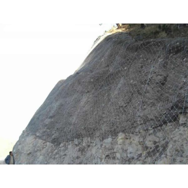 GPS2 rockfall netting anchored on rock face with support ropes