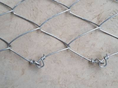 A piece of tecco mesh with knotted ends.